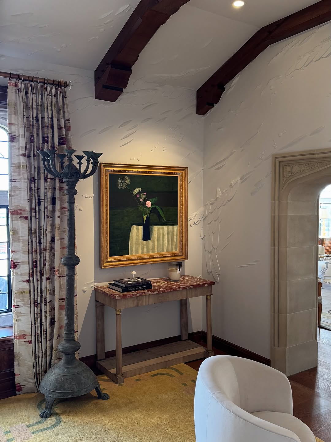 Sculpted relief across a living room wall and ceiling